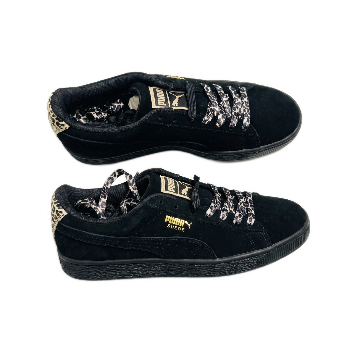 Side profile views of both shoes, showing black suede, leopard heel tabs, and black soles.