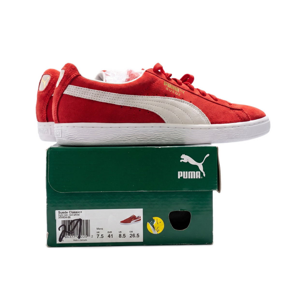 Side profile of one red sneaker on its box, showing the box's size label.