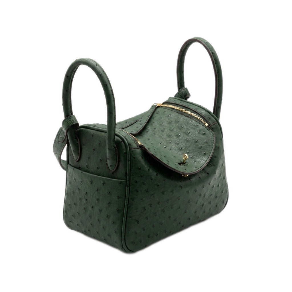 Green ostrich-embossed leather mini bowling bag, three-quarter front view