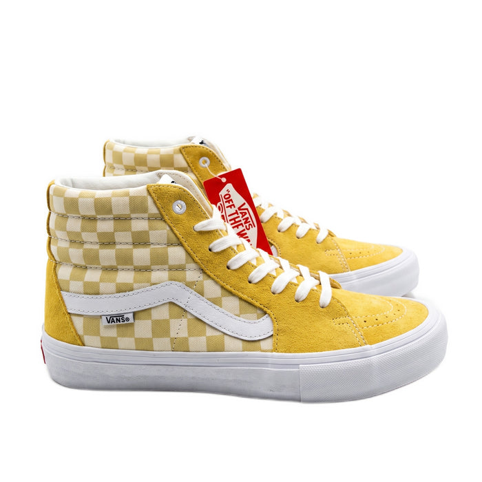Side profile view of yellow and checkerboard canvas high-top sneakers.