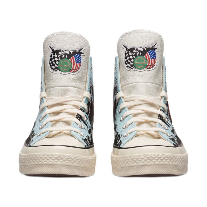 Front view of both shoes showing the tongue patches and cream laces.