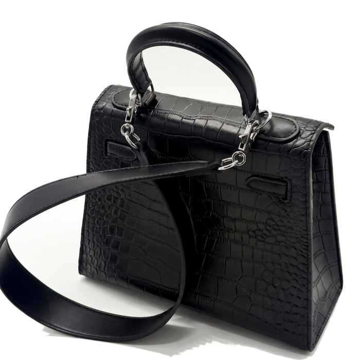With the detachable leather strap laid out