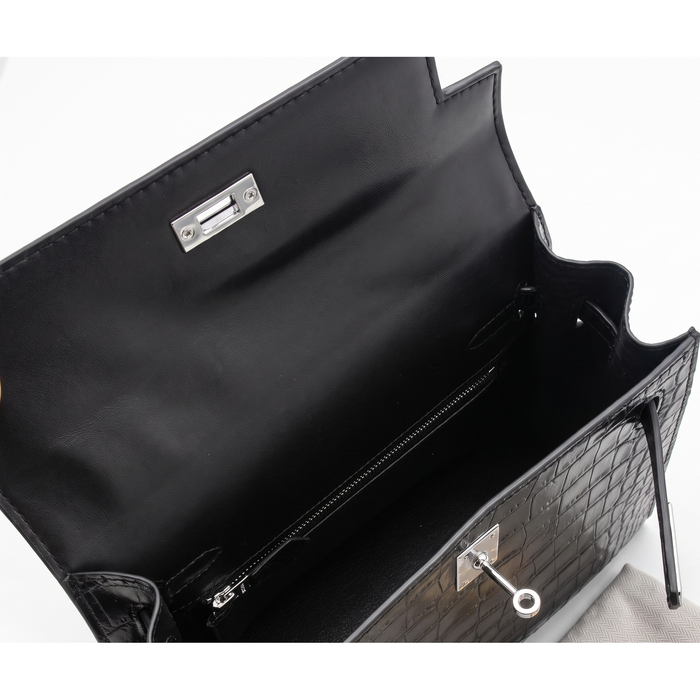 Interior, fully lined with an interior zip pocket