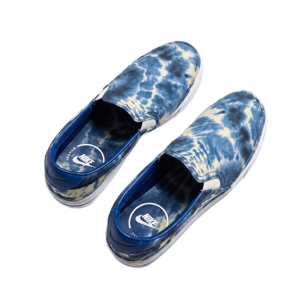 Angled overhead view of the shoes, showing the interior and outer canvas.