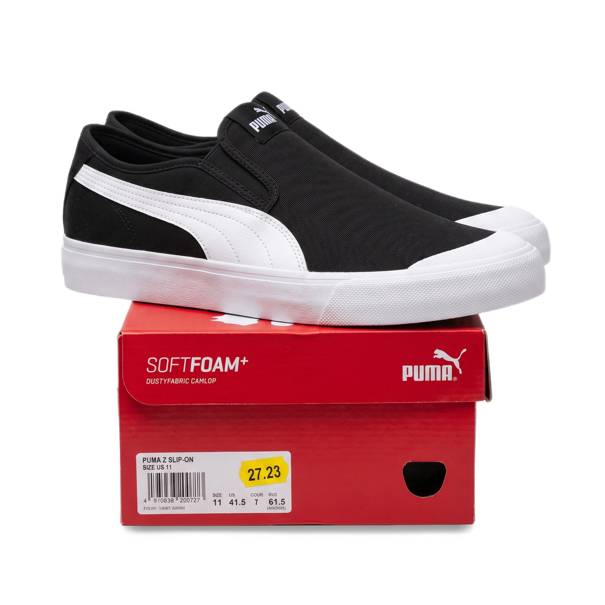Side profile view of sneakers on top of a red shoebox with the size label showing.