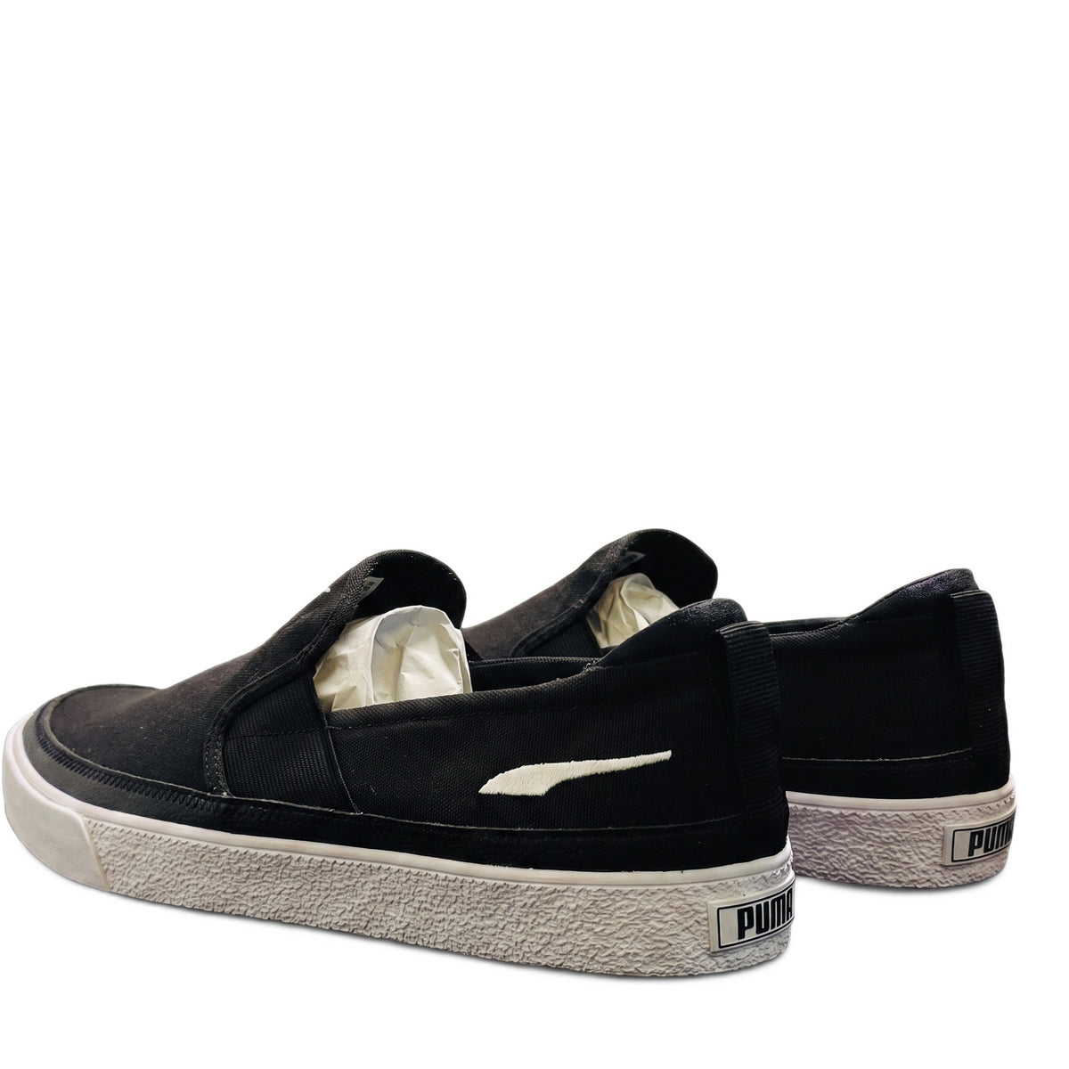 Rear three-quarter view showing the heels with the white Puma cat logo.