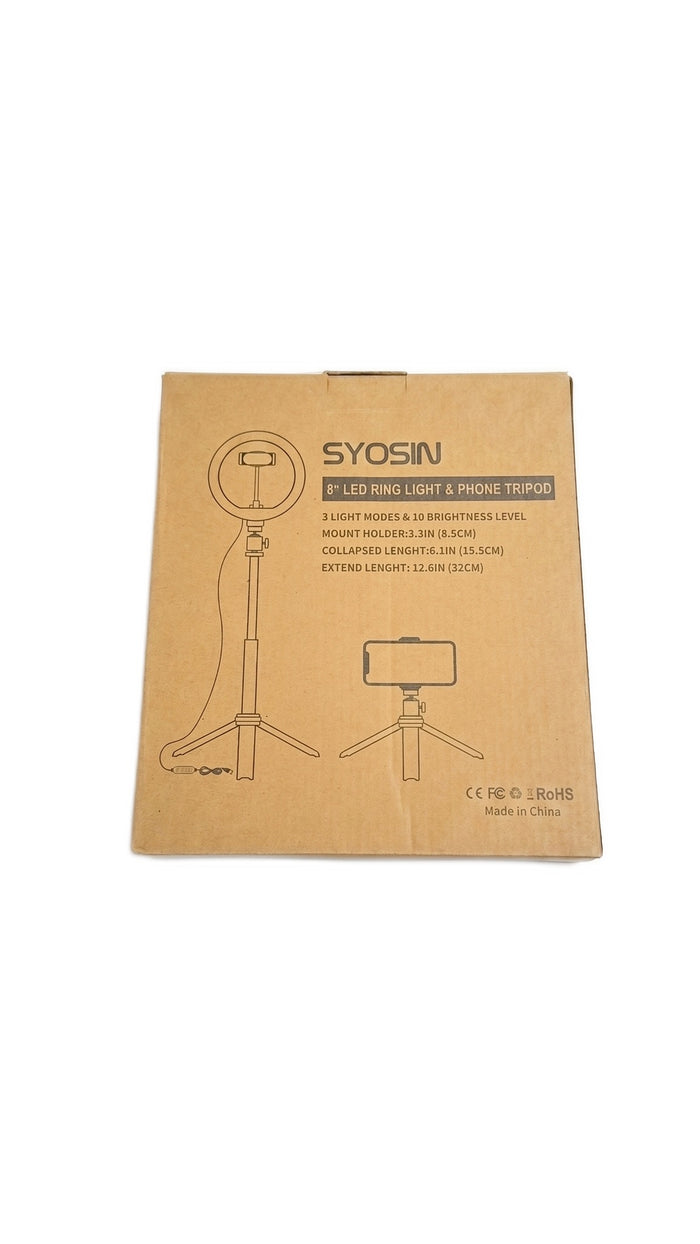 Front view of the brown cardboard packaging box containing the ring light kit.