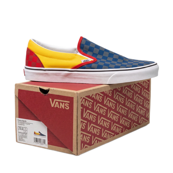 Side profile of the right shoe sitting on top of its red and cardboard Vans box.