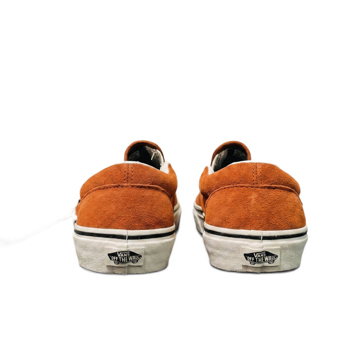 Rear view of the brown slip-on shoes showing the white midsoles and black Vans heel logos.
