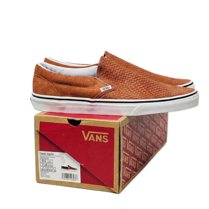 Three-quarter view of the shoes sitting on top of their red Vans shoebox.