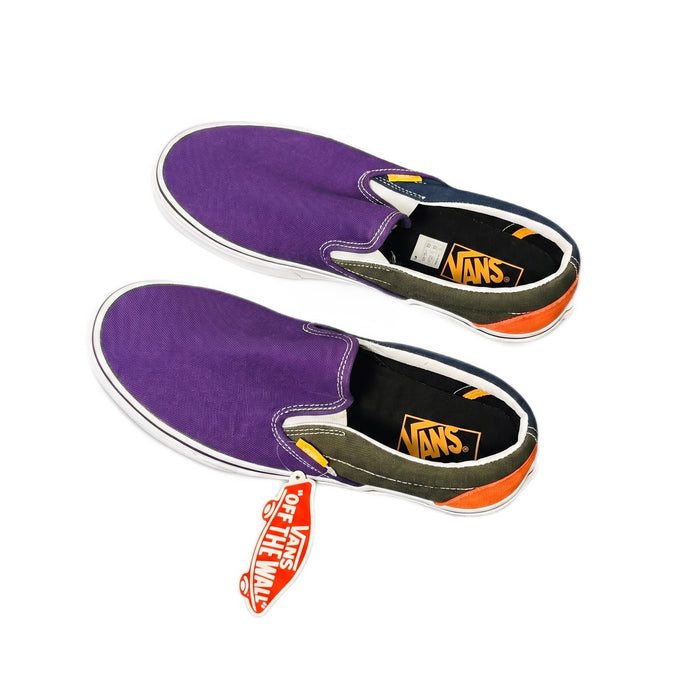 Three-quarter view of the shoes showing purple canvas, green sides, and red hangtag.