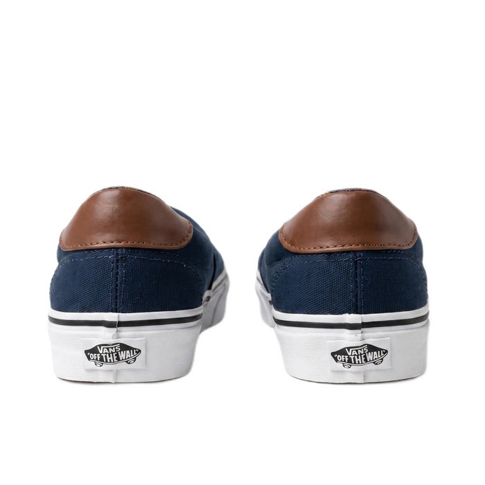 Heel view of both shoes showing brown leather tabs and white heel patches.