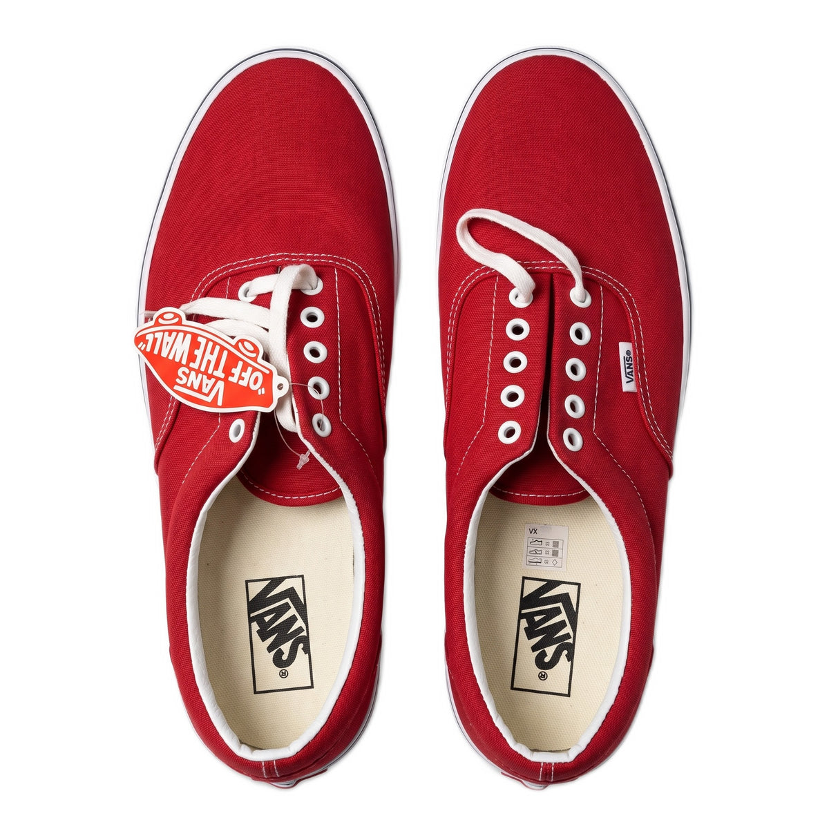 Top-down view of the pair of red sneakers with white insoles and laces.