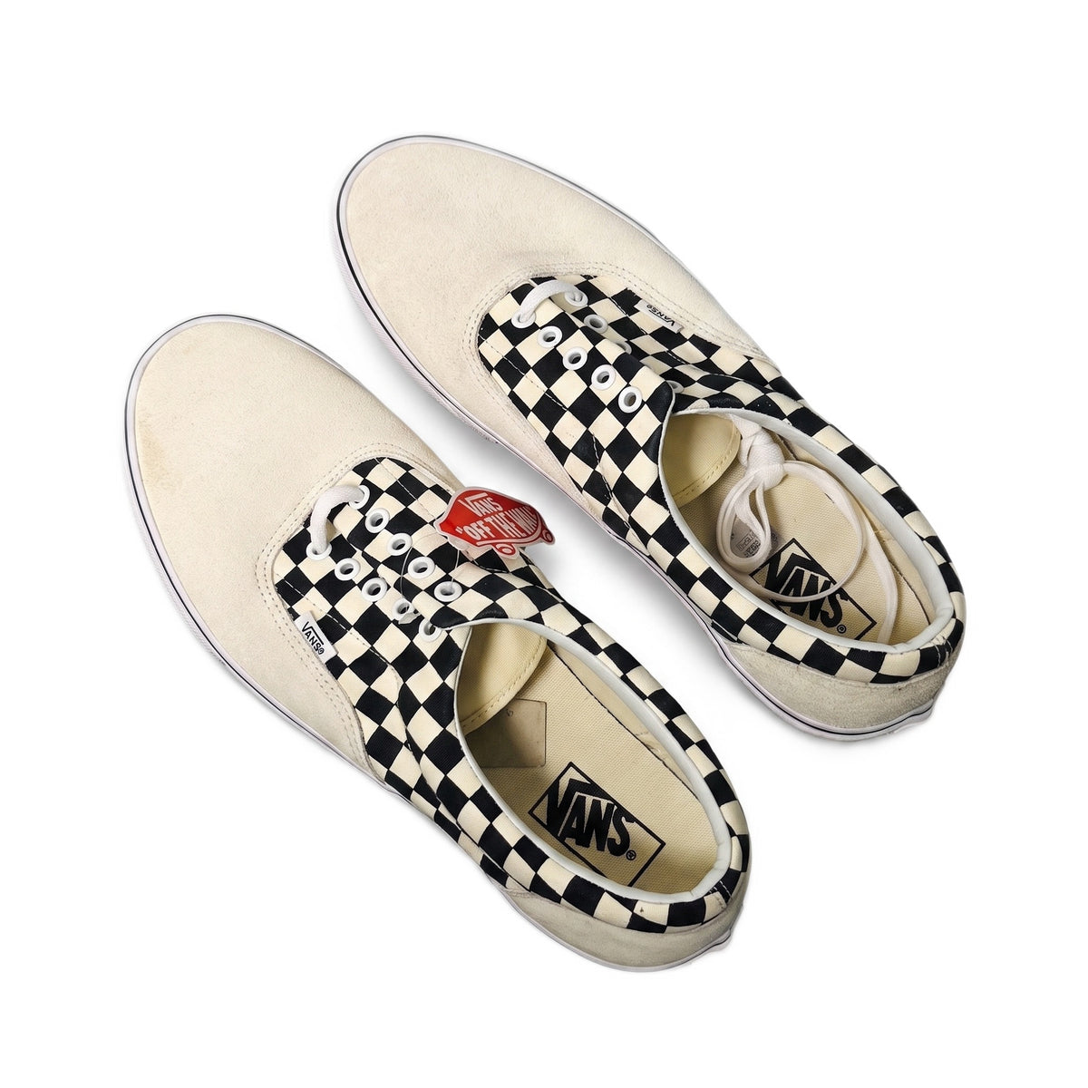 Top-down view of the sneakers angled to show the heels and insoles.