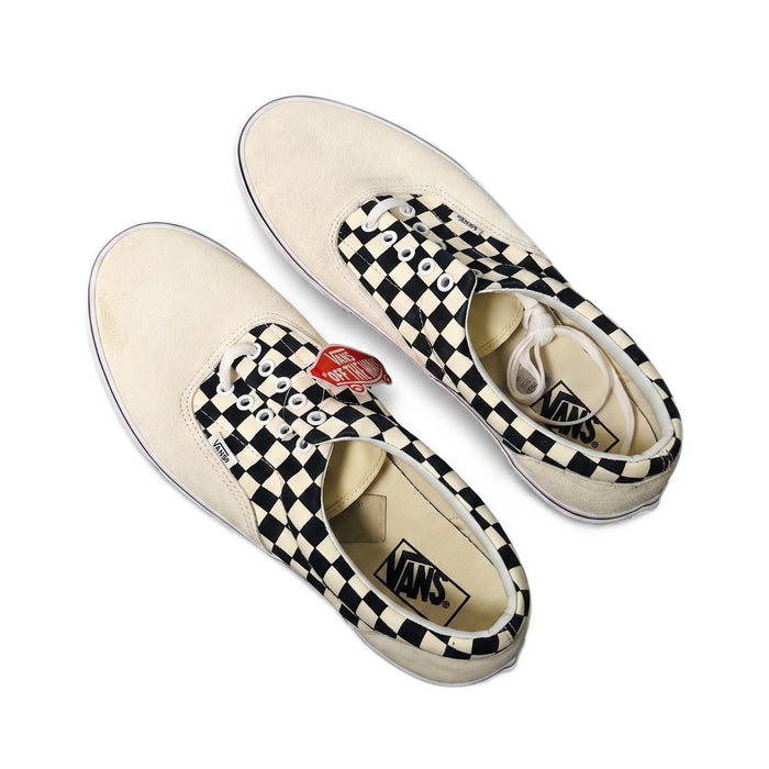 Top-down view of the sneakers angled to show the heels and insoles.